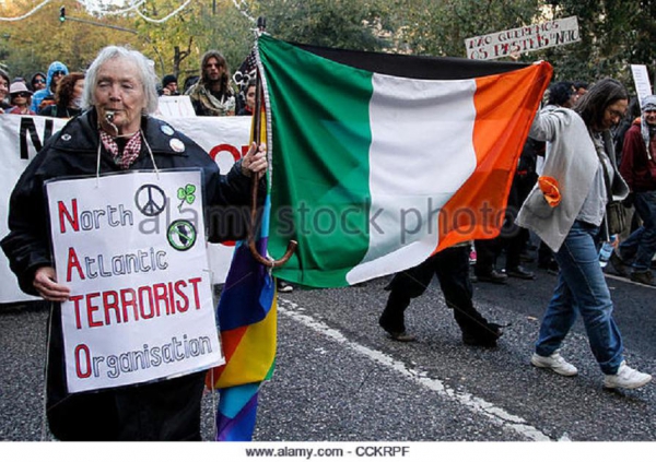 43 qter nov-20-2010-lisbon-portugal-anti-nato-old-woman-holds-a-flag-during-cckrpf.jpg